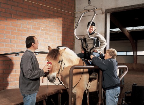 SureHands - Horseback riding - Horseback riding with the SureHands body support and the ceiling motor -